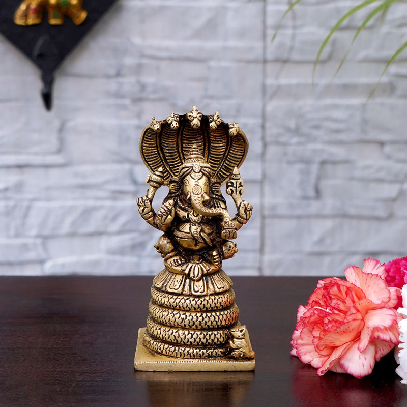 Ganesha sitting on snake